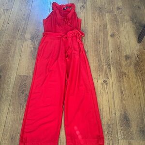 Chetta B Red Sleeveless Wide-Leg Jumpsuit with Ruffled Neck and Tie Waist